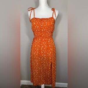 Beautiful burnt orange floral dress with cute tie on straps.